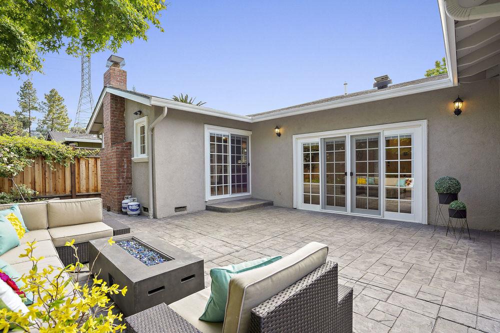 222 Thomas Drive Los Gatos, CA 95032 - Photo 5 of 28 a backyard of a house with sofas table and sofas