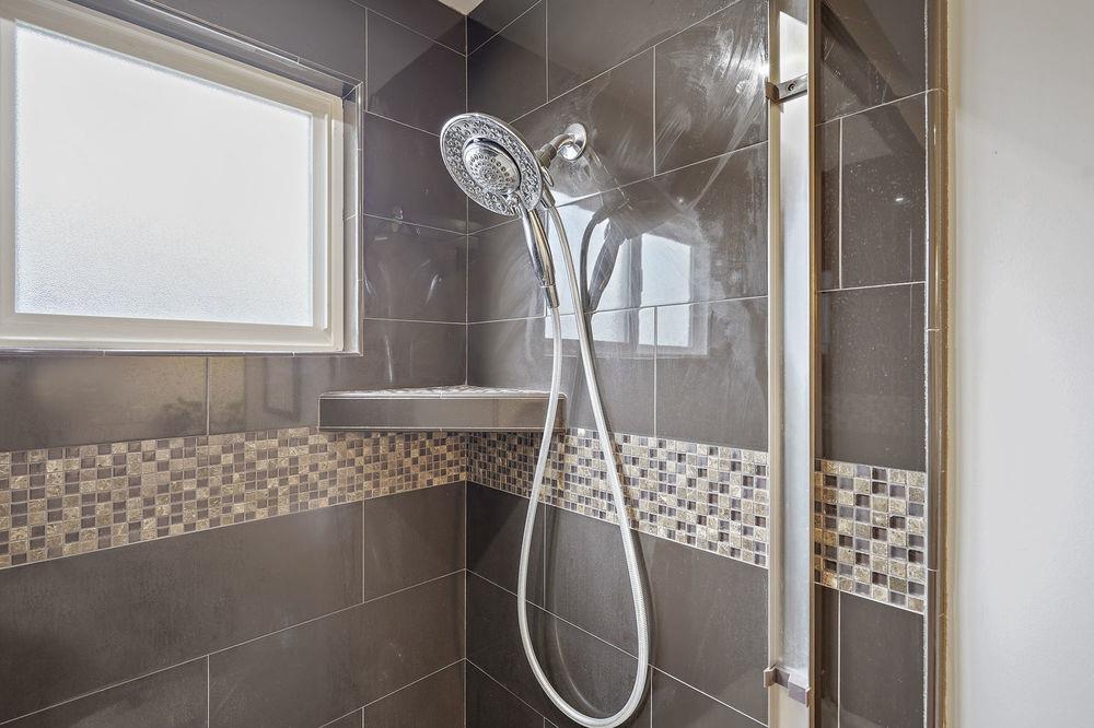 222 Thomas Drive Los Gatos, CA 95032 - Photo 8 of 28 a bathroom with a bathtub and shower