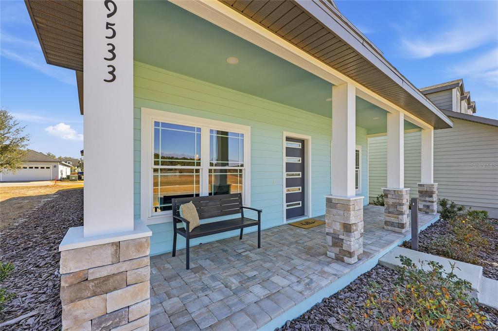 9533 Southwest 66th Lane Gainesville, FL 32608 - Photo 2 of 32 a front view of a house with outdoor seating
