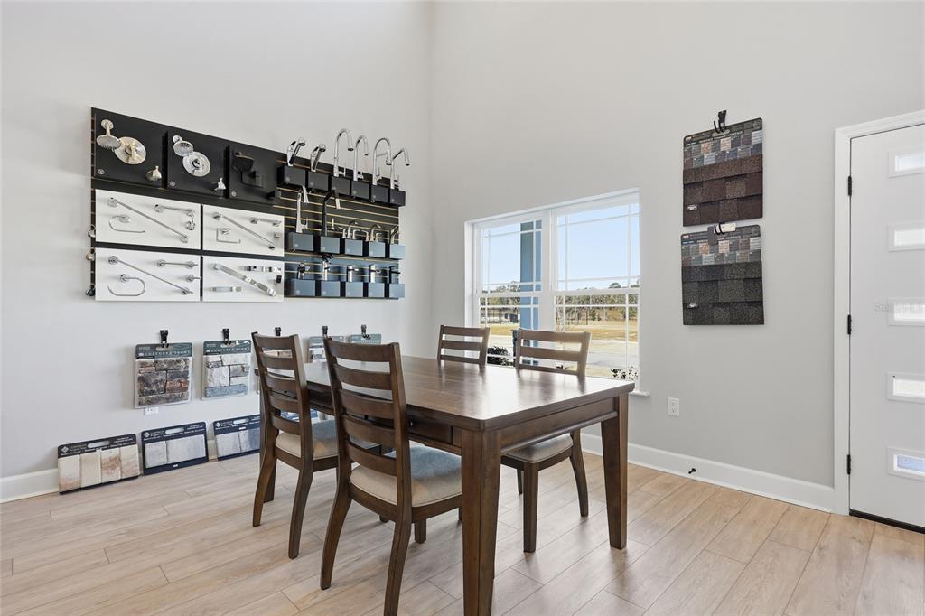 9533 Southwest 66th Lane Gainesville, FL 32608 - Photo 31 of 32 a view of a dining room with furniture and wooden floor