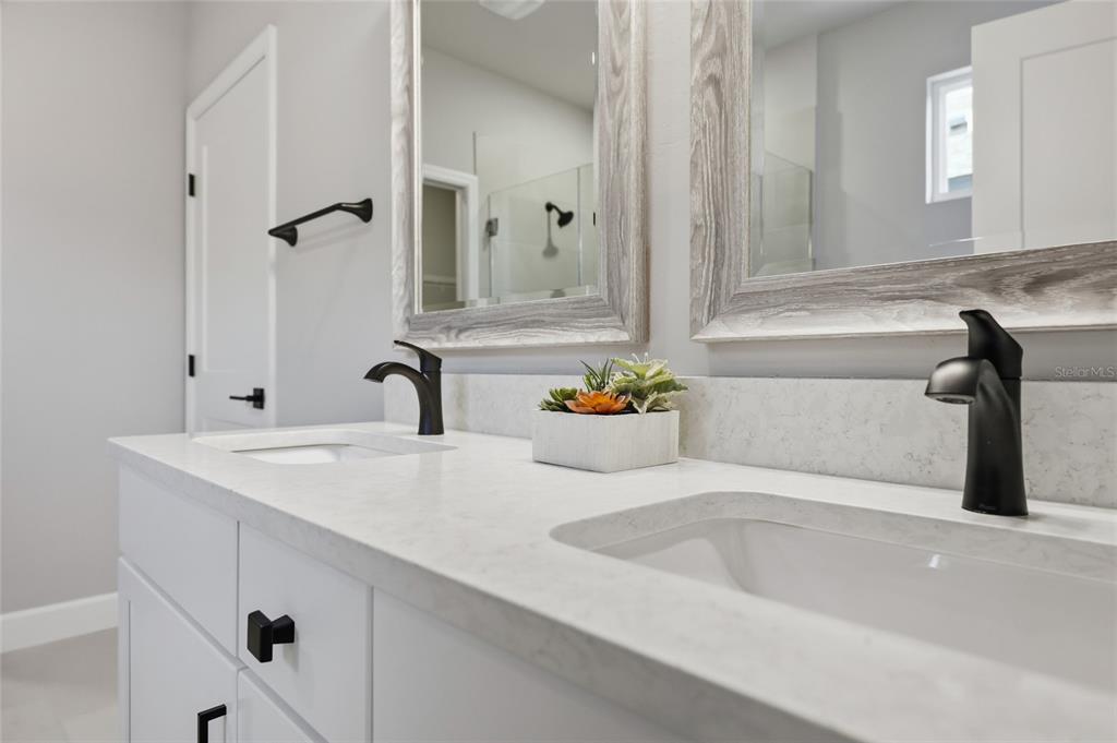 9533 Southwest 66th Lane Gainesville, FL 32608 - Photo 9 of 32 a bathroom with a sink and a mirror