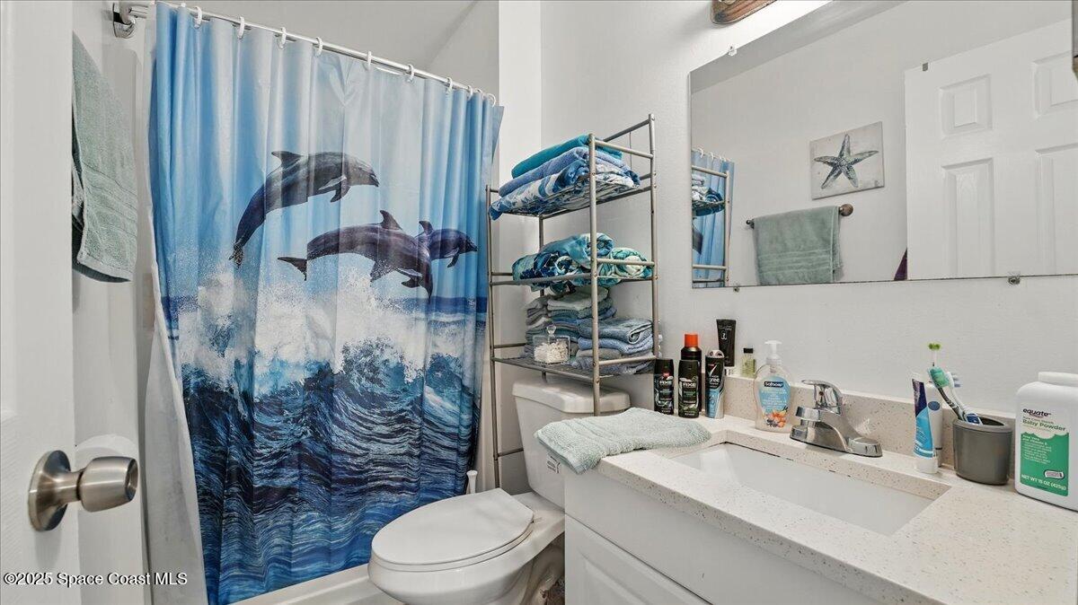 6615 Dock Avenue Cocoa, FL 32927 - Photo 17 of 38 a bathroom with a sink toilet and shower