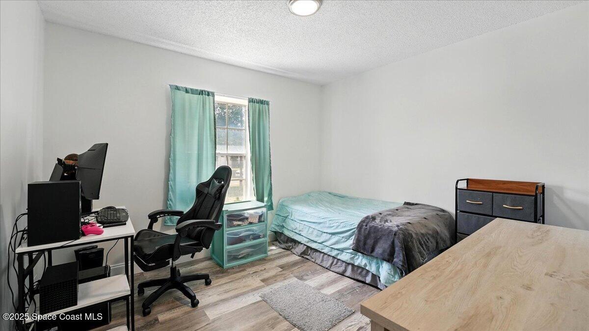 6615 Dock Avenue Cocoa, FL 32927 - Photo 18 of 38 a bedroom with furniture and a window