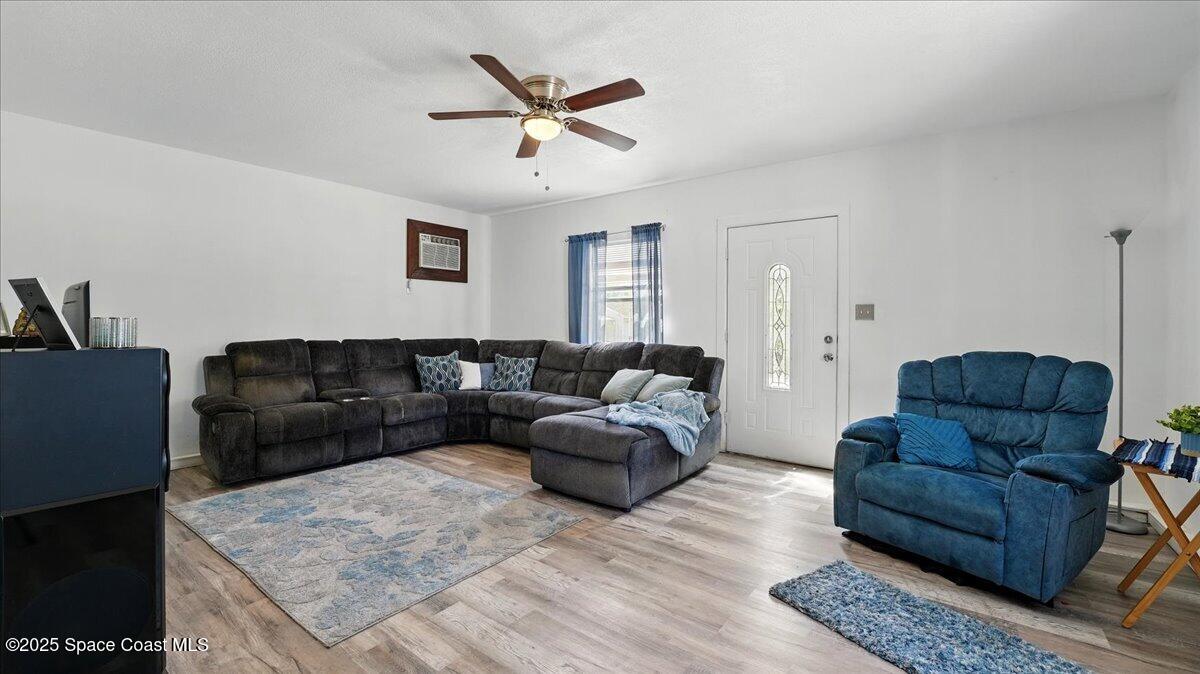 6615 Dock Avenue Cocoa, FL 32927 - Photo 22 of 38 a living room with furniture and a rug