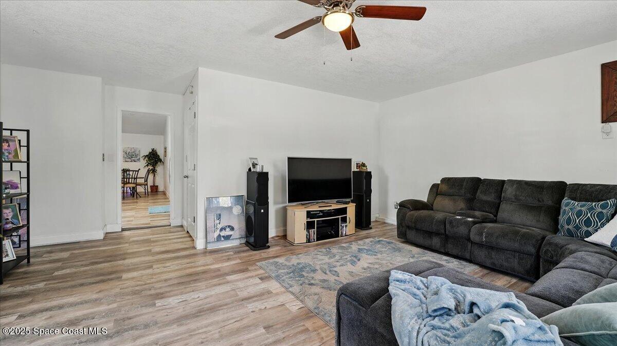 6615 Dock Avenue Cocoa, FL 32927 - Photo 23 of 38 a living room with furniture and a flat screen tv