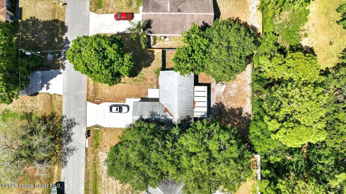 6615 Dock Avenue Cocoa, FL 32927 - Photo 28 of 38 a sign that is sitting in front of a tree