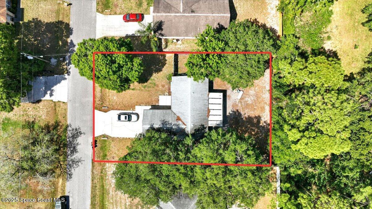 6615 Dock Avenue Cocoa, FL 32927 - Photo 29 of 38 an aerial view of residential house with sign board and yard