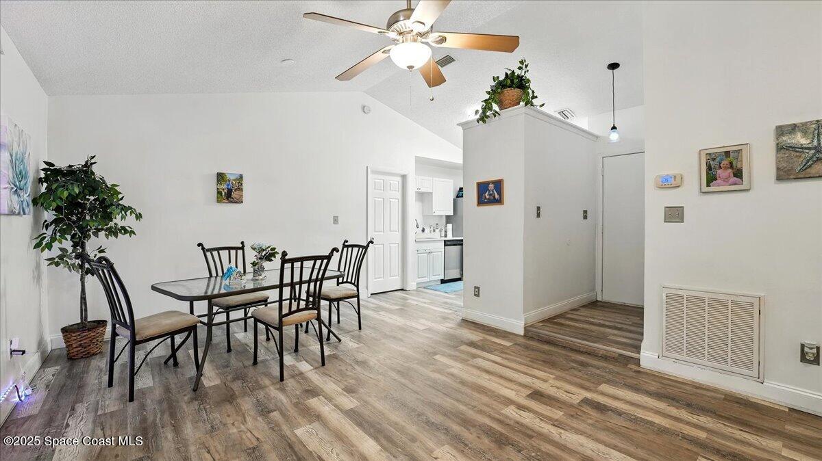 6615 Dock Avenue Cocoa, FL 32927 - Photo 6 of 38 a view of a dining room with furniture and wooden floor