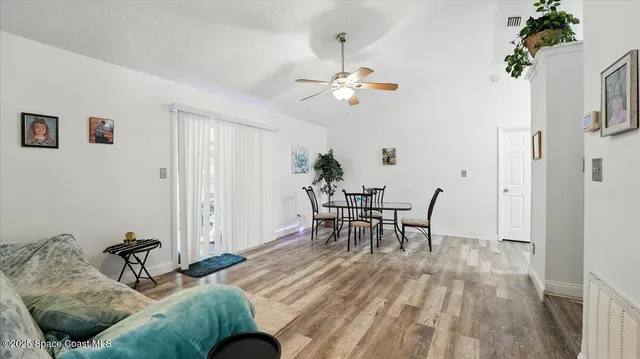 a view of a livingroom with furniture and wooden floor