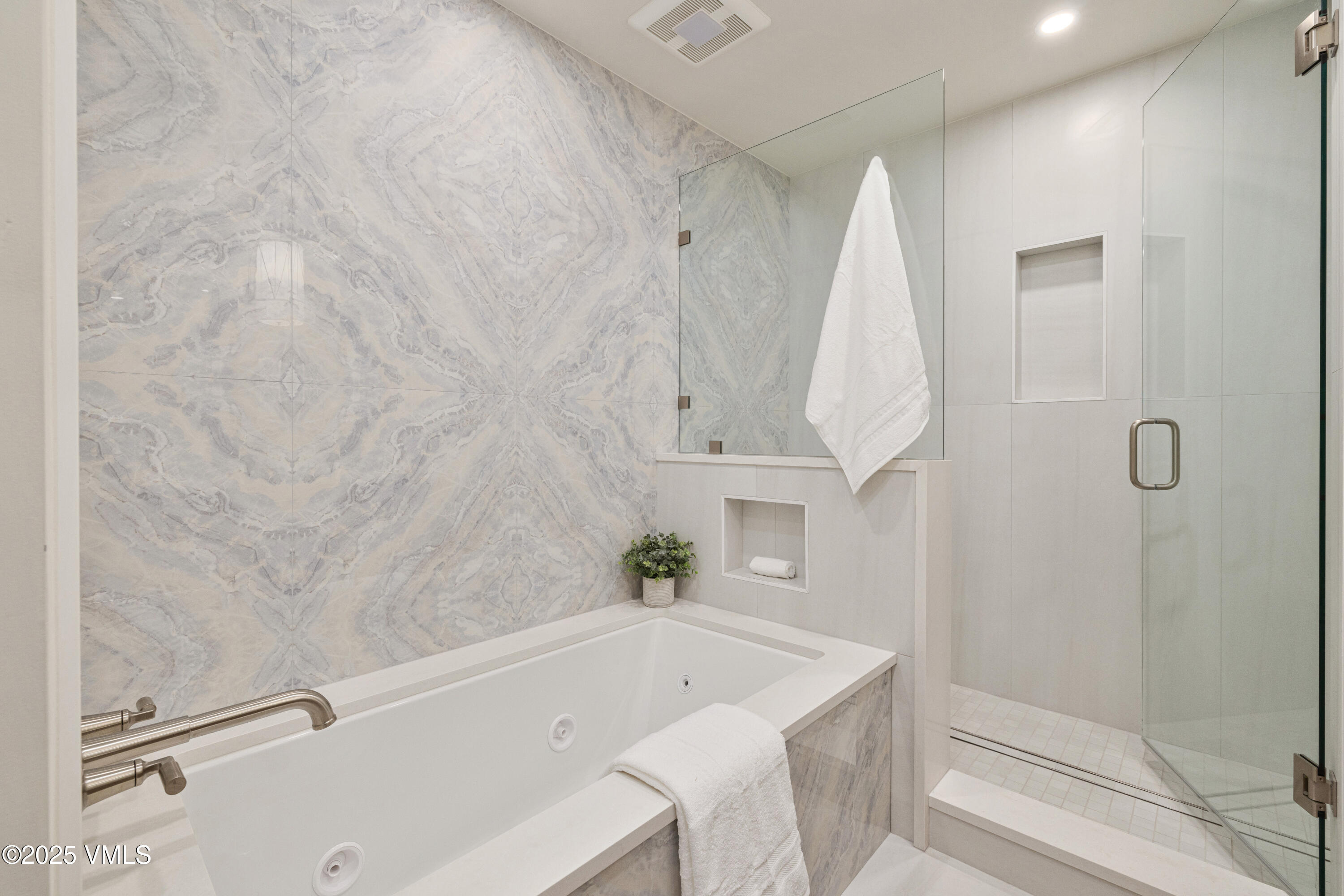 1881 Lions Ridge Loop, Unit 2 Vail, CO 81657 - Photo 19 of 41 a bathroom with a tub a sink and a shower