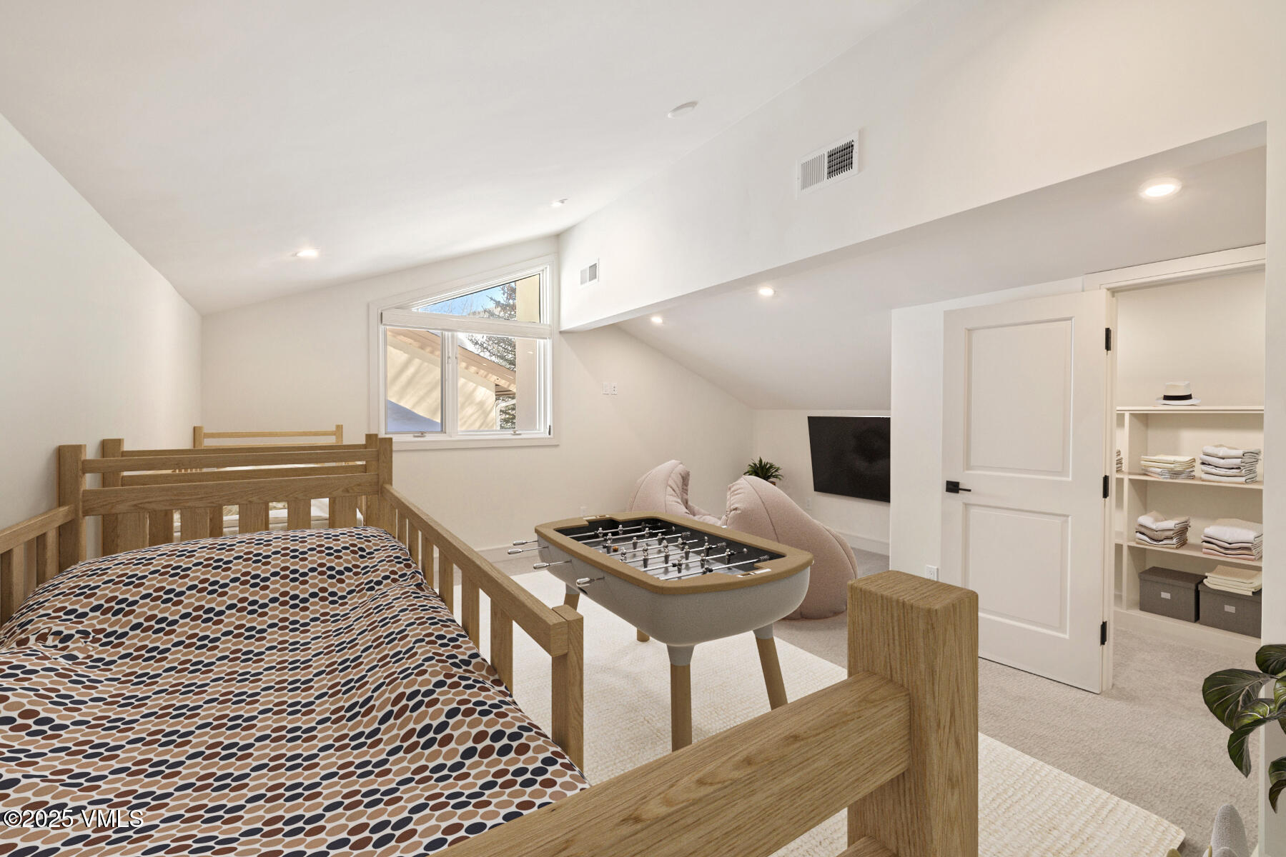 1881 Lions Ridge Loop, Unit 2 Vail, CO 81657 - Photo 24 of 41 a bedroom with furniture and a table