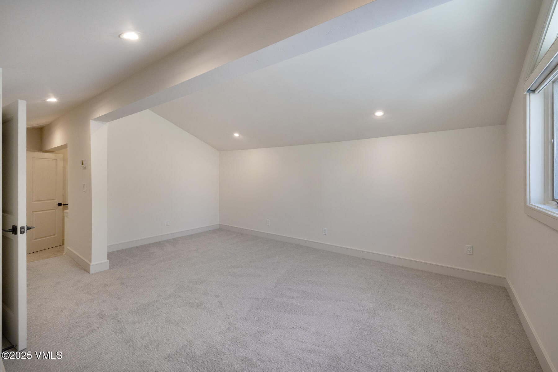 1881 Lions Ridge Loop, Unit 2 Vail, CO 81657 - Photo 27 of 41 an empty room with a empty space and windows