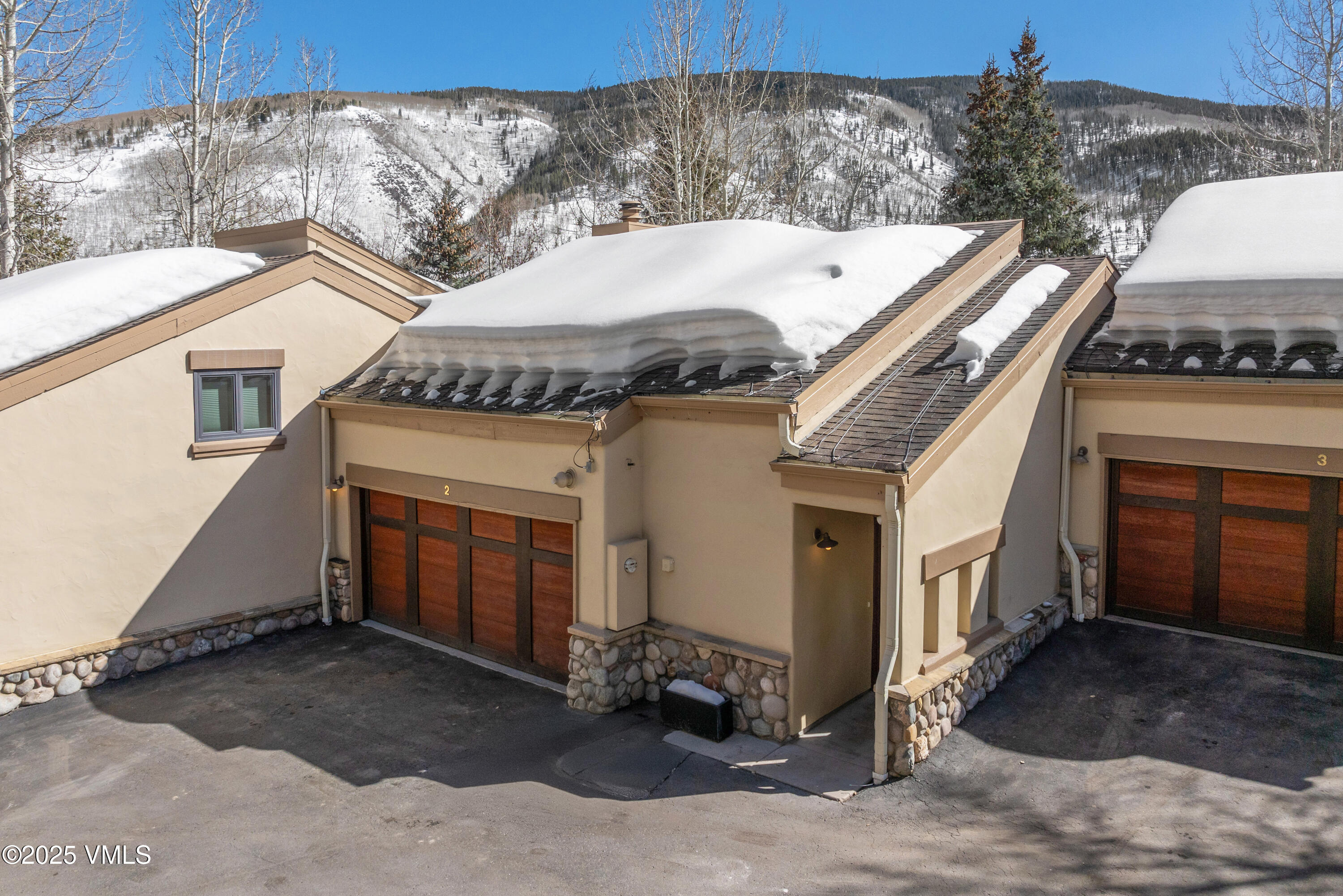 1881 Lions Ridge Loop, Unit 2 Vail, CO 81657 - Photo 33 of 41 a aerial view of a house with a garage