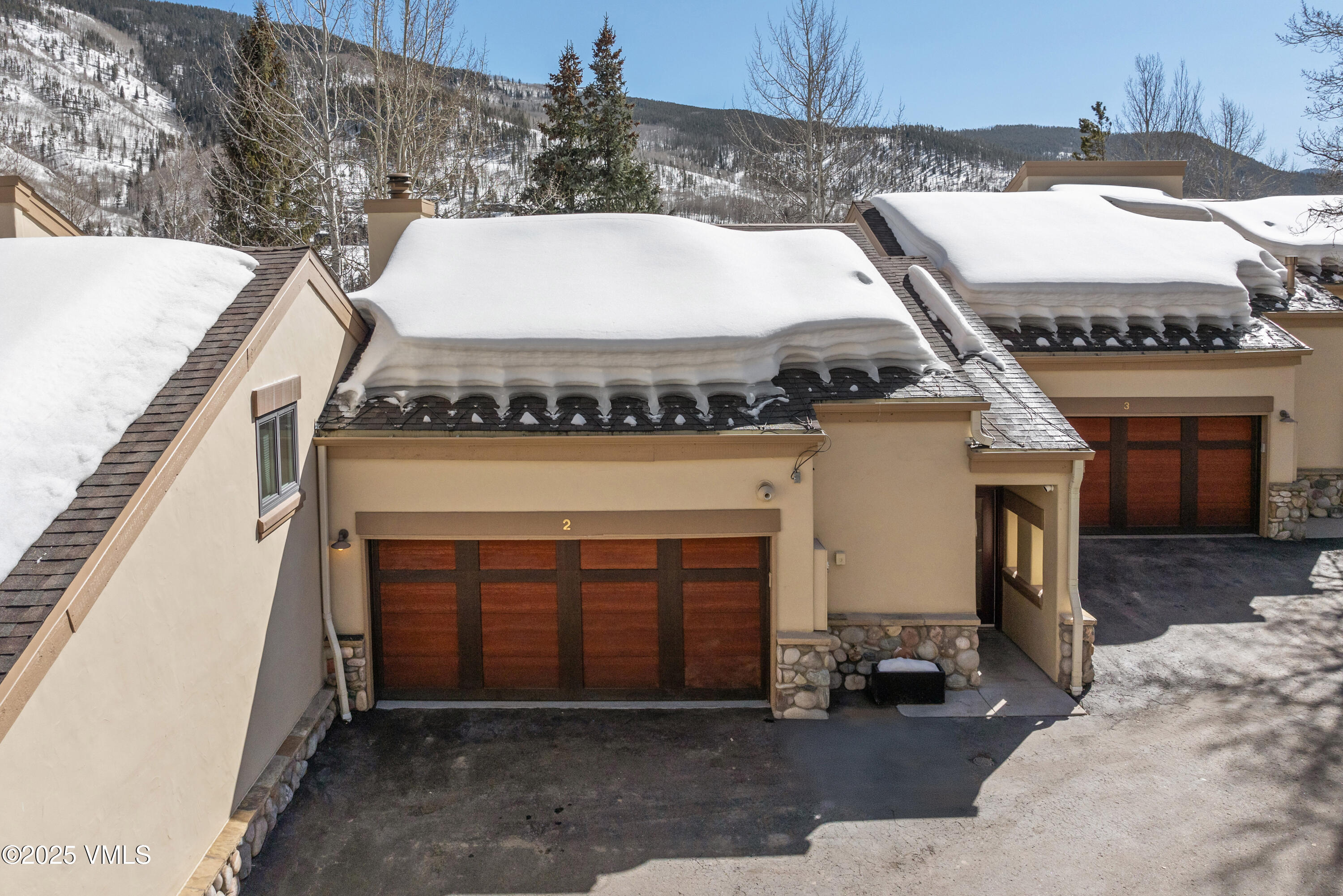 1881 Lions Ridge Loop, Unit 2 Vail, CO 81657 - Photo 34 of 41 a front view of a house with a yard