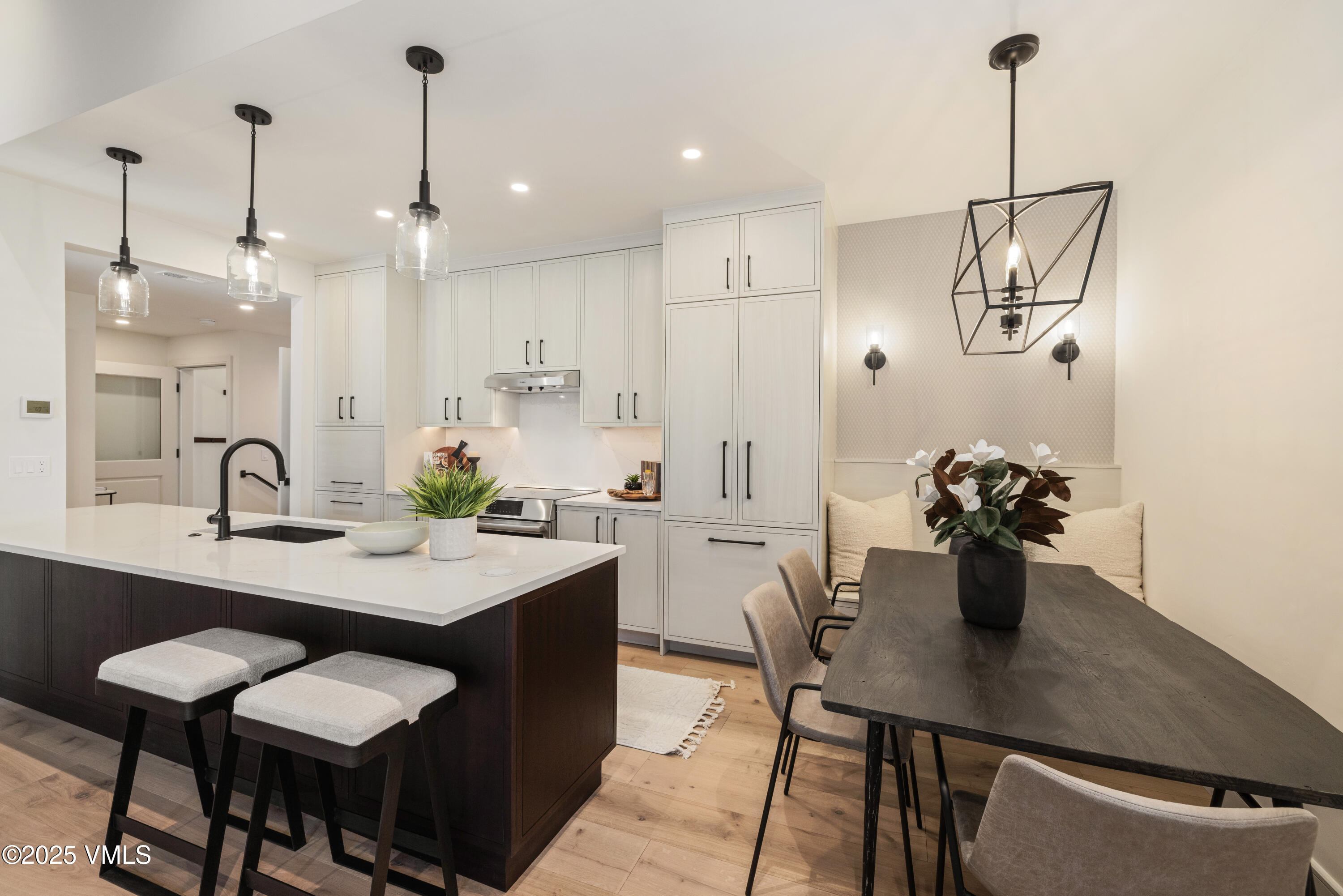 1881 Lions Ridge Loop, Unit 2 Vail, CO 81657 - Photo 9 of 41 a kitchen with a table and chairs in it