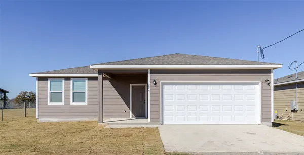 a front view of a house with a garage