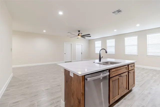 a kitchen with a sink and window