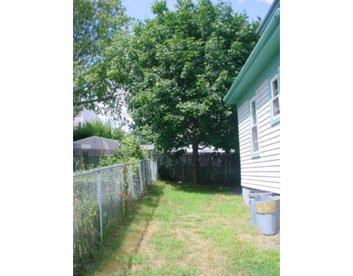 1457 Rodman Street Fall River, MA 02721 - Photo 15 of 16 a backyard of a house with lots of green space