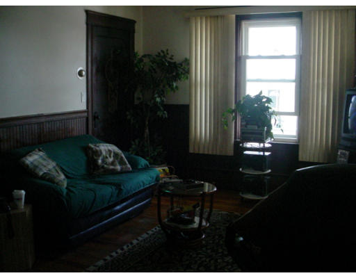 1457 Rodman Street Fall River, MA 02721 - Photo 2 of 16 a living room with furniture and a potted plant