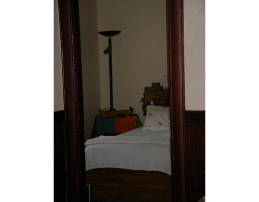1457 Rodman Street Fall River, MA 02721 - Photo 4 of 16 a bedroom with a bed and a closet