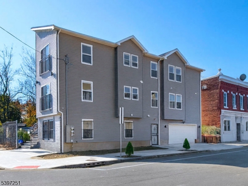 32 North 14th Street, Unit 2 Newark, NJ 07107 - Photo 12 of 14 a front view of a building with street