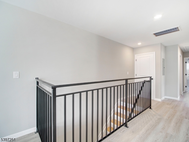 32 North 14th Street, Unit 2 Newark, NJ 07107 - Photo 3 of 14 a view of hallway with wooden floor