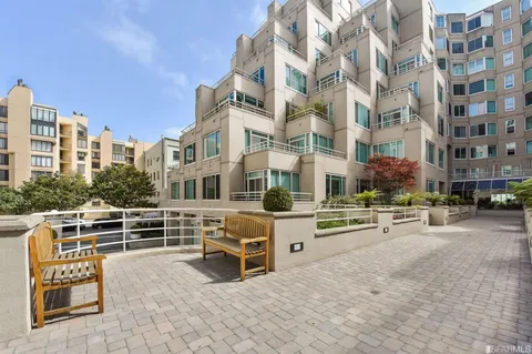 a view of a building with sitting area
