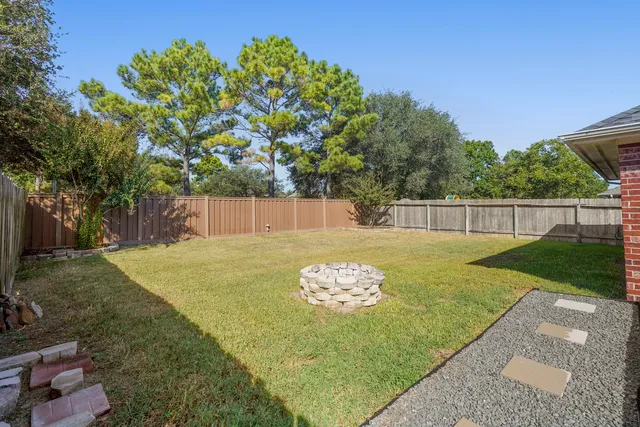 a front view of a house with a yard table and chairs