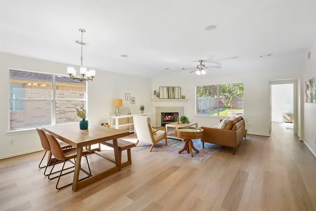a view of a livingroom with furniture window and wooden floor