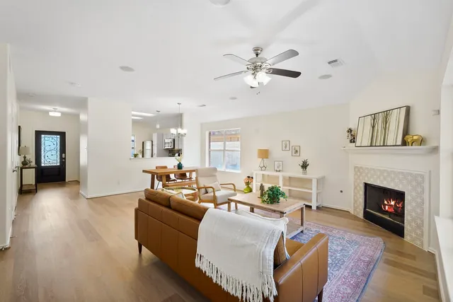a living room with furniture and a fireplace