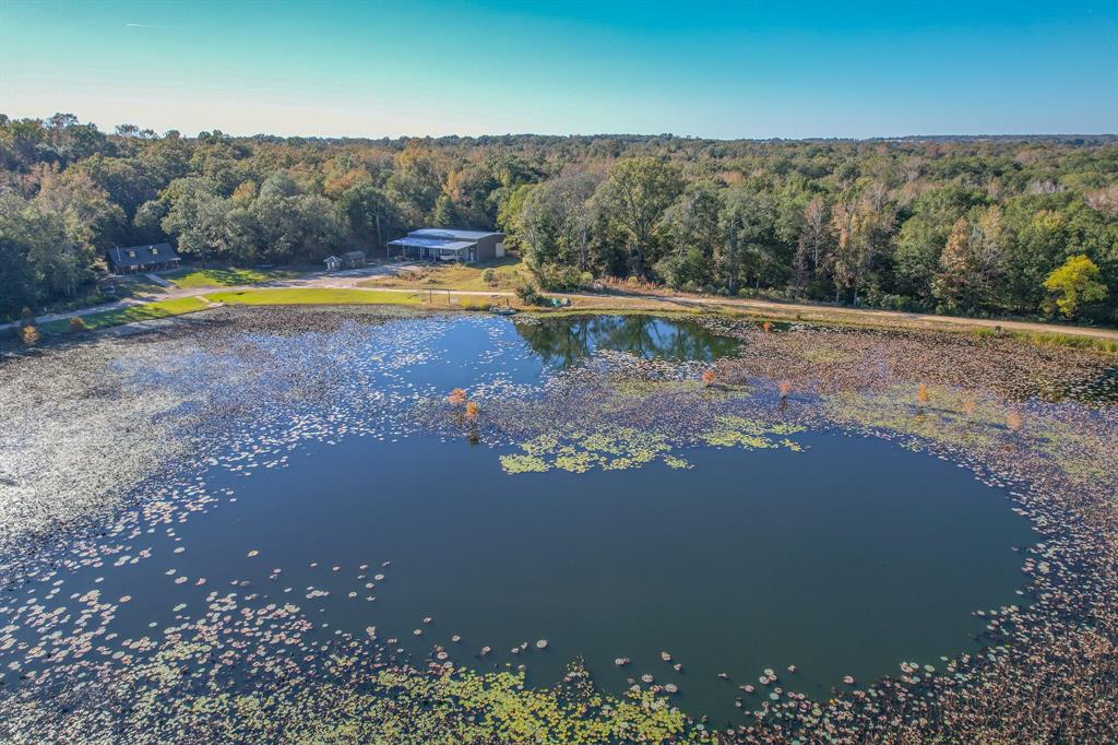 a view of a lake with a yard