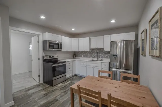 a bathroom with a toilet a sink and a shower