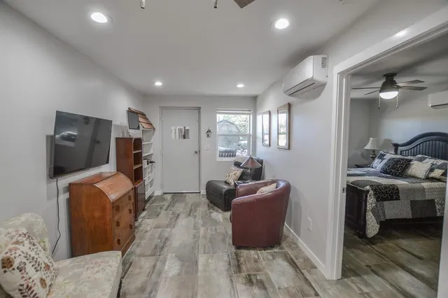 wooden bathroom with double sink and a mirror