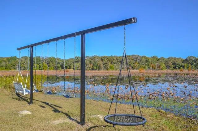a view of lake with green space