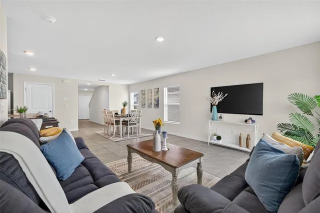 a bathroom with a shower sink vanity mirror and toilet