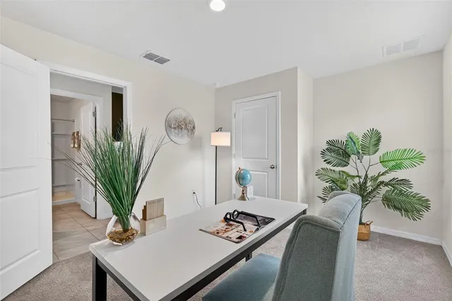 a spacious bedroom with a bed and a window