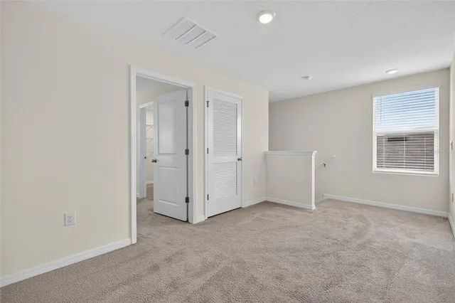 a bathroom with a double vanity sink mirror and shower