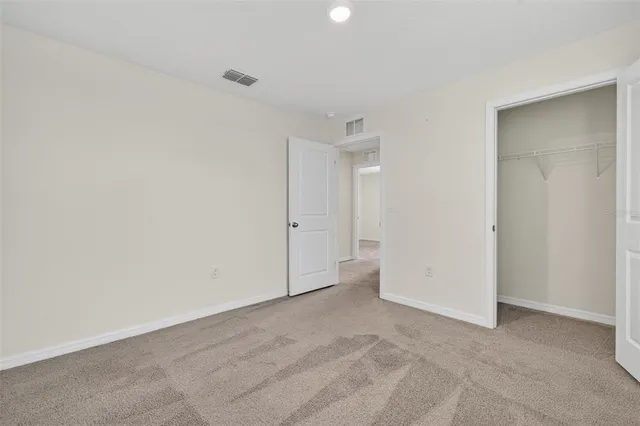an aerial view of residential houses with outdoor space and ocean view