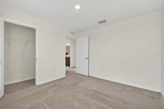 a view of a lake with couches and wooden floor