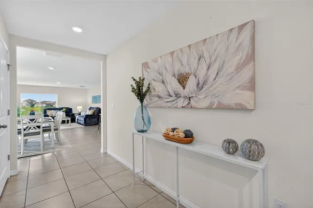 a view of living room with furniture and painting on the wall