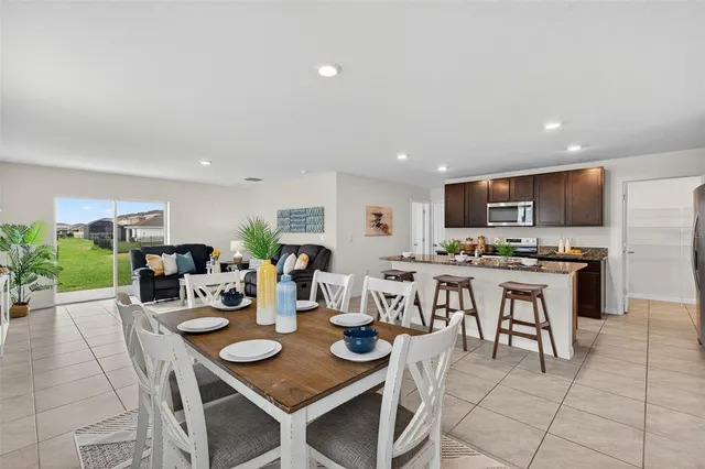 a view of kitchen with dining table and chairs
