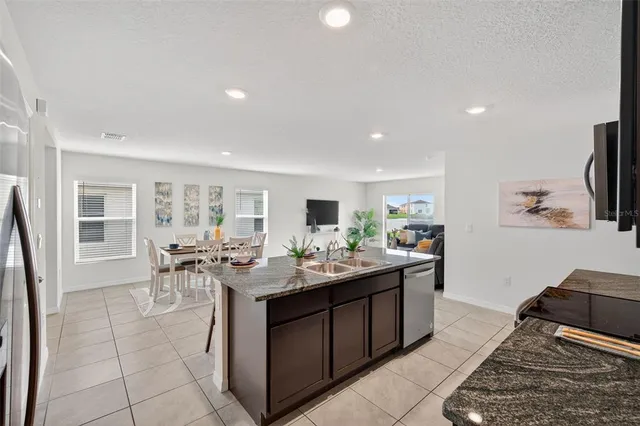a kitchen with sink and stove