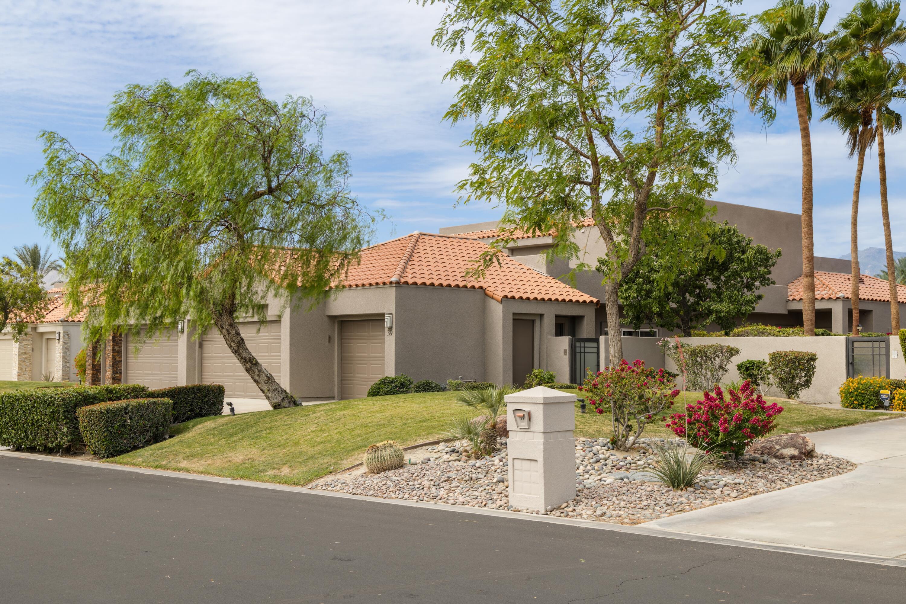 39 Augusta Drive Rancho Mirage, CA 92270 - Photo 52 of 53 a front view of house with yard and trees around