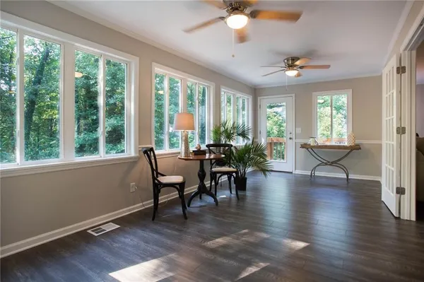a view of a dining room with furniture window and wooden floor
