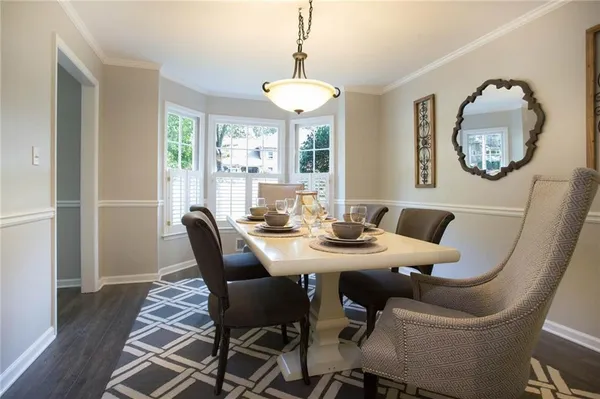 a view of a dining room with furniture window and outside view