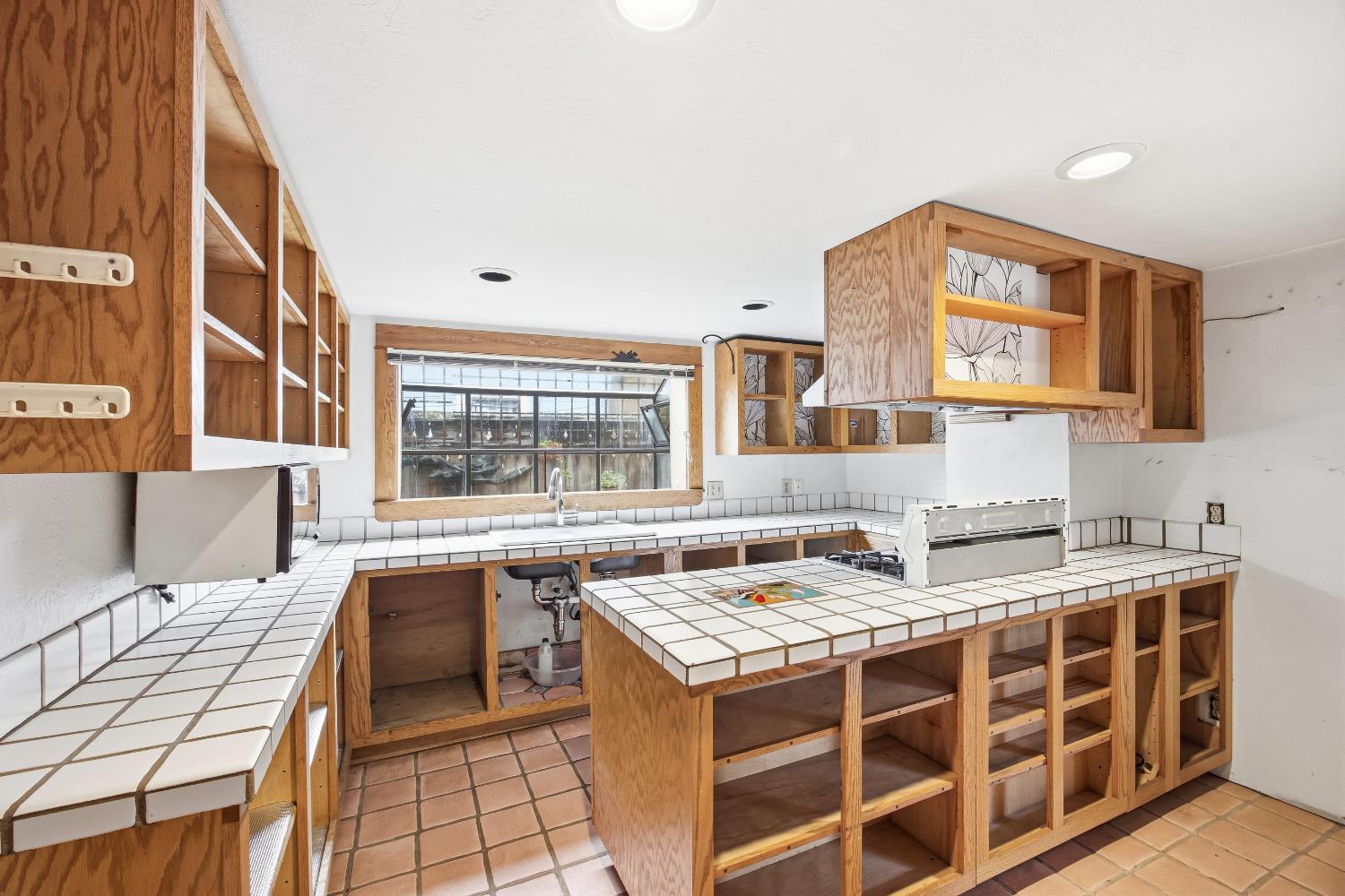 2013 Ninth Street Berkeley, CA 94710 - Photo 20 of 38 a kitchen with a stove a sink and a cabinets