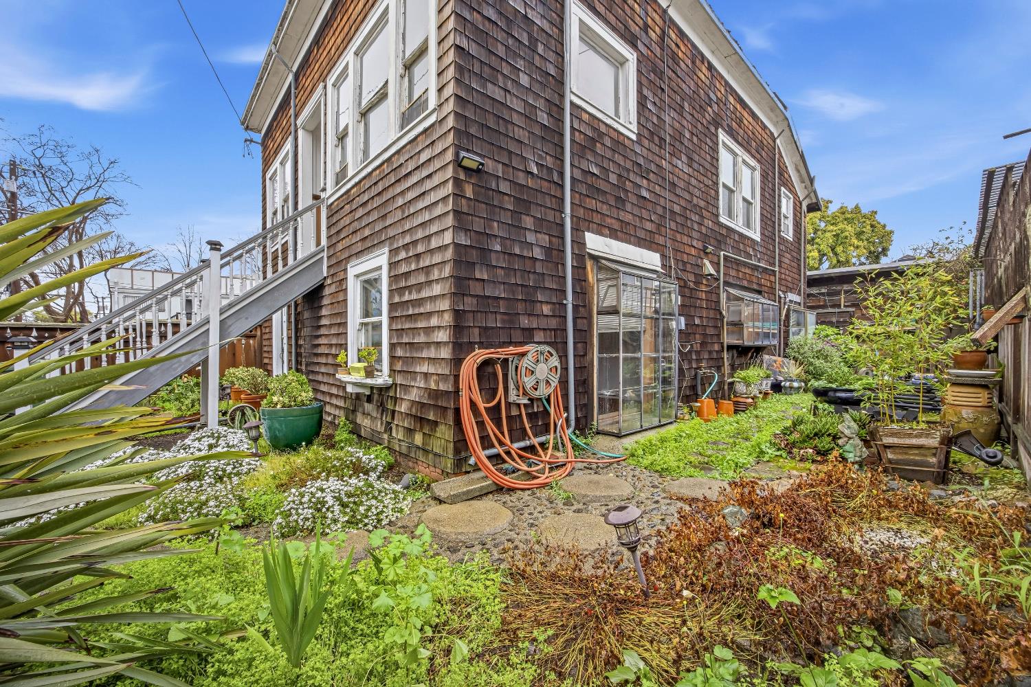 2013 Ninth Street Berkeley, CA 94710 - Photo 2 of 38 a view of a building with a yard and table and chairs