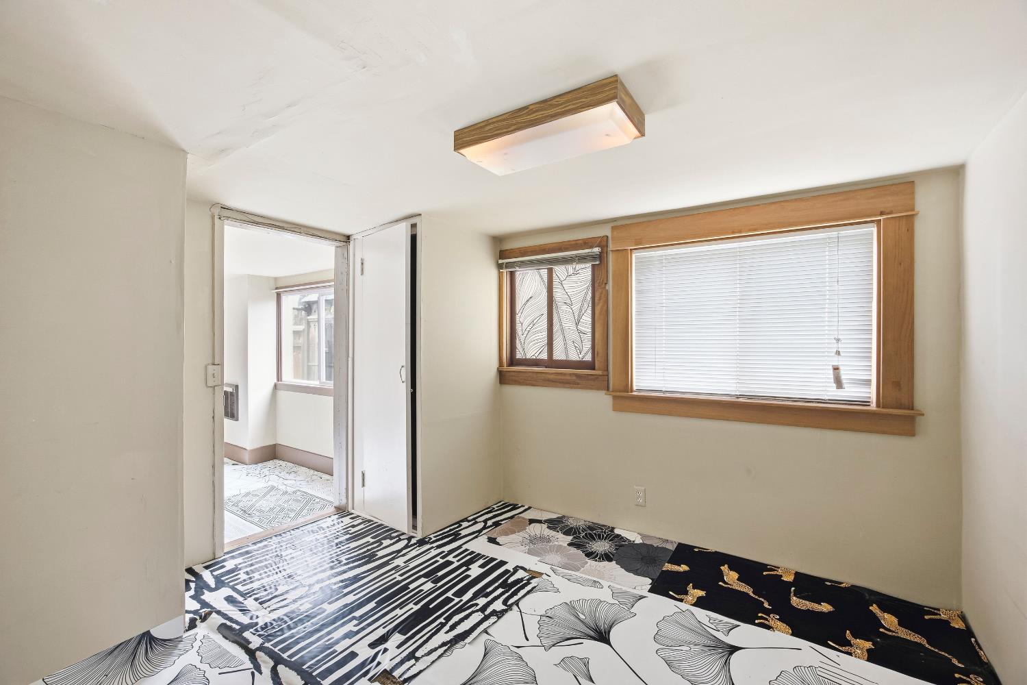 2013 Ninth Street Berkeley, CA 94710 - Photo 25 of 38 a bedroom with a bed and a window