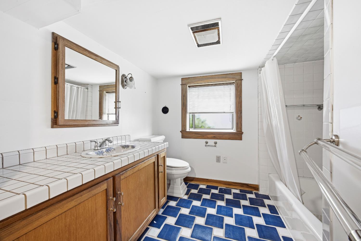 2013 Ninth Street Berkeley, CA 94710 - Photo 26 of 38 a bathroom with a sink a toilet and a mirror