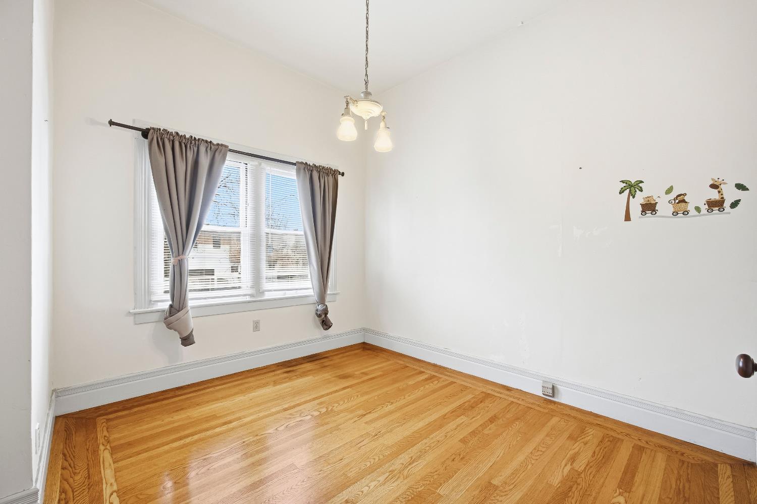 2013 Ninth Street Berkeley, CA 94710 - Photo 6 of 38 a view of a room with wooden floor and windows